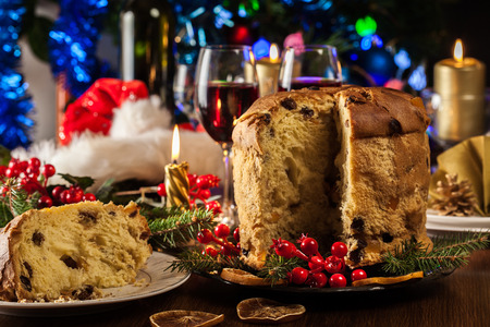 Christmas panettone cake with raisins and fruits. Traditional Italian dishの写真素材