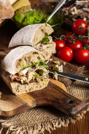 Italian porchetta sandwich. Ciabatta with rolled pork bellyの写真素材