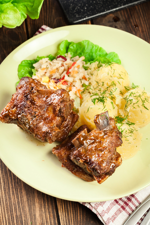 Pork spare ribs served with mashed potatoes and sauce. Ready for eat. Top viewの写真素材