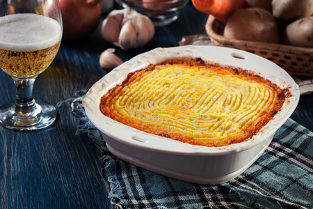 Shepherd's pie or cottage pie. Minced beef meat and vegetables with mashed potatoes in casserole dishの写真素材