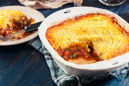 Shepherd's pie or cottage pie. Minced beef meat and vegetables with mashed potatoes in casserole dishの写真素材