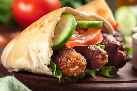 Cevapcici or cevapi served with pita bread and vegetablesの写真素材
