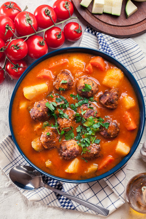 Albondigas - tomato soup with meatballs and vegetables. Spanish and Mexican dishの写真素材