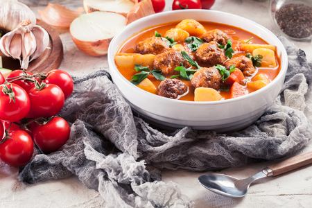 Albondigas - tomato soup with meatballs and vegetables. Spanish and Mexican dishの写真素材
