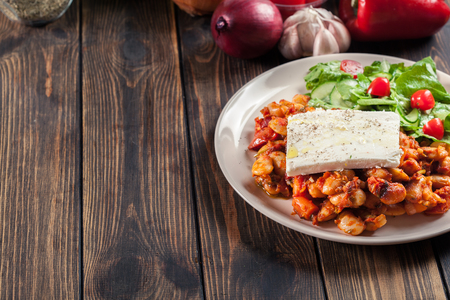 Baked giant beans with feta cheese and tomato sauce. Greek traditional foodの写真素材