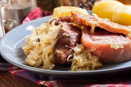 Choucroute garnie. Alsatian sauerkraut with sausages, knuckle and baconの写真素材