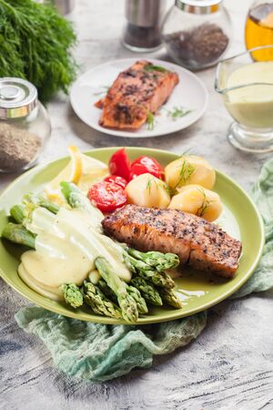 Baked salmon with asparagus and hollandaise sauce.Spring dishの写真素材
