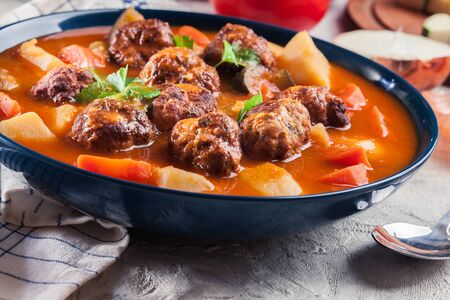 Albondigas - tomato soup with meatballs and vegetables. Spanish and Mexican dishの写真素材