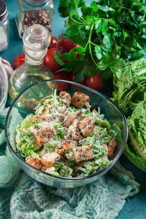 Healthy caesar salad with cheese and croutons. Italian cuisineの写真素材