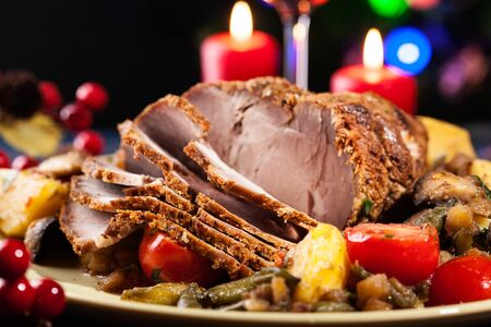 Juicy roast pork on the holiday table. Shallow depth of fieldの写真素材
