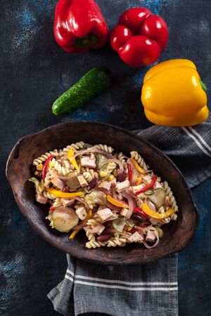 Fusilli pasta salad with smoked turkey and vegetablesの写真素材