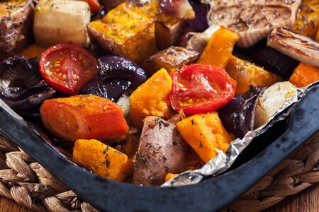 Roasted vegetables on baking metal tray. Vegetarian dishの写真素材