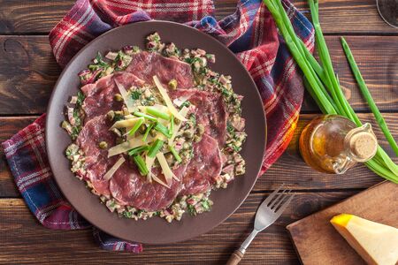 Beef carpaccio with arugula and parmesan. Italian dishの写真素材