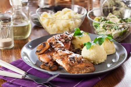 Delicious chicken marsala served with fettucine pasta. Italian cuisineの写真素材