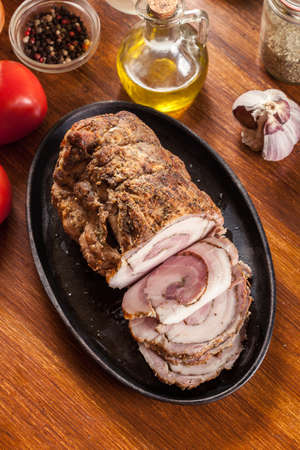 Baked pork belly roulade. Sliced bacon rollsの写真素材