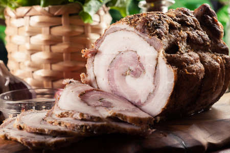 Baked pork belly roulade. Sliced bacon rollsの写真素材