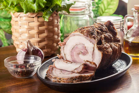 Baked pork belly roulade. Sliced bacon rollsの写真素材