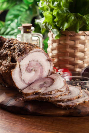 Baked pork belly roulade. Sliced bacon rollsの写真素材