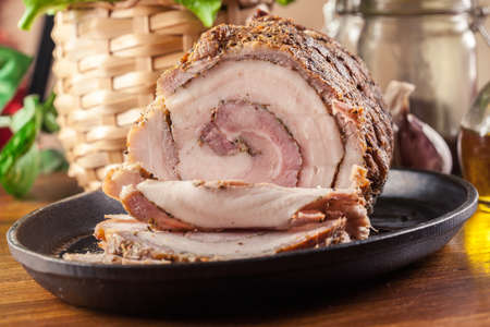 Baked pork belly roulade. Sliced bacon rollsの写真素材