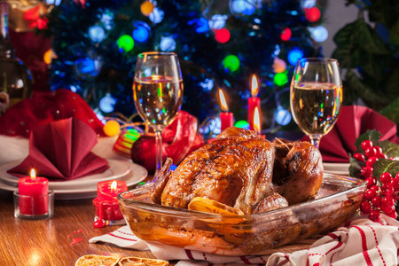 Baked or roasted whole chicken on Christmas table. Xmas dinnerの写真素材