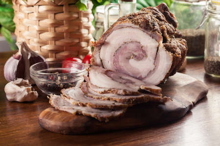 Baked pork belly roulade. Sliced bacon rollsの写真素材