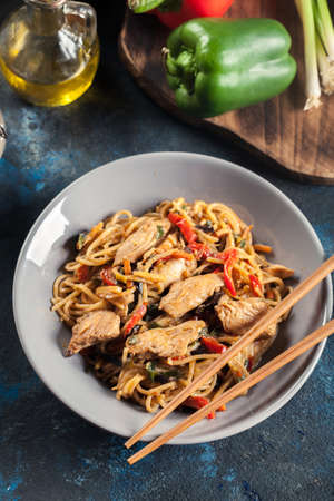 Chicken chow mein. Popular fried noodles with chicken and vegetablesの写真素材
