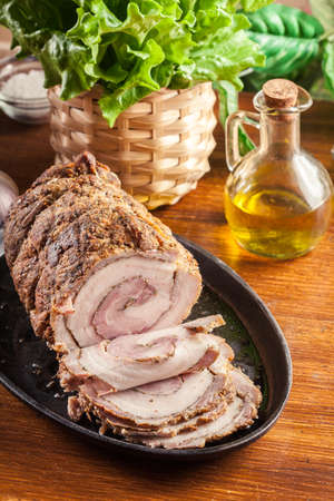 Baked pork belly roulade. Sliced bacon rollsの写真素材