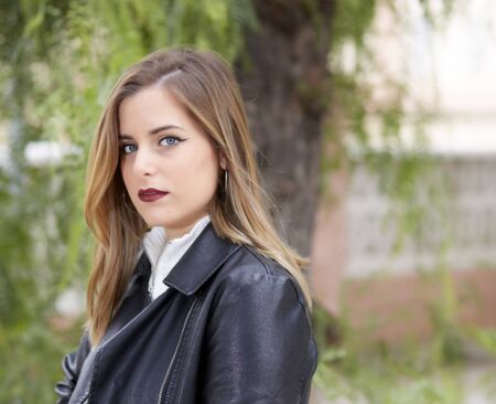 portraits of blonde girl with unfocused backgroundsの写真素材