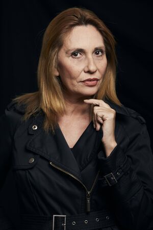 Portrait of a beautiful woman with black backgroundの写真素材