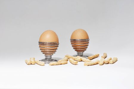 still life of chicken eggs on white background in iron bowl
