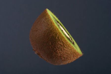 Ripe Juicy Kiwi Fruit, Half Full. Studio shoot retouched.の写真素材