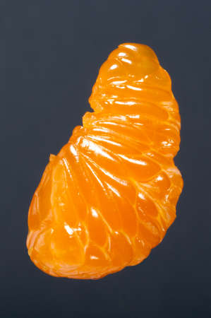 Part of tangerine or mandarin fruit. Studio shoot.