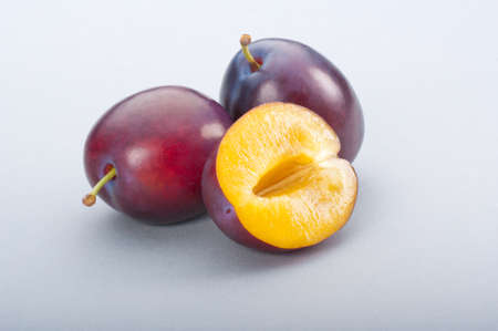 Fresh plums on white background. Studio shoot.の写真素材