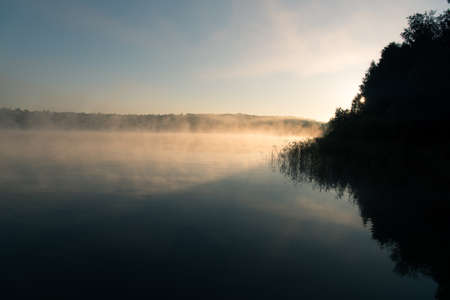 Morning mist on the lakeの写真素材