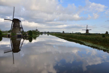 Windmills at Kinderdijk on a cloudy summer day in the Netherlands. Summer.の写真素材