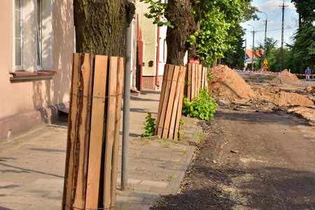 Protection of trees during road renovation in the city. Environment.の写真素材