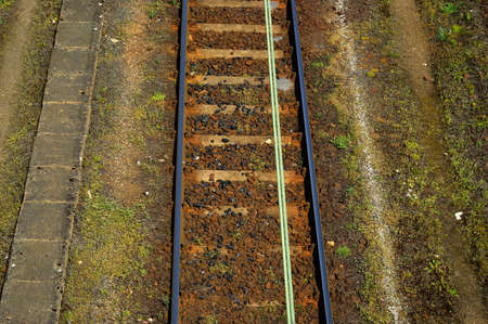 Railway infrastructure, rails, power supply, signaling. Summer.
