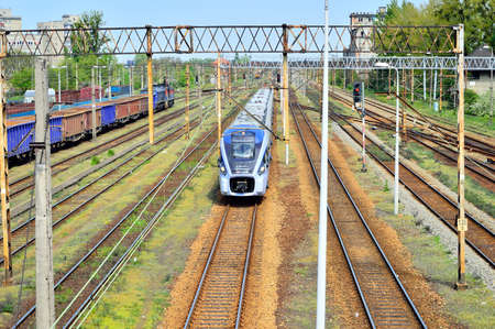 Railway infrastructure, rails, power supply, signaling. Summer.