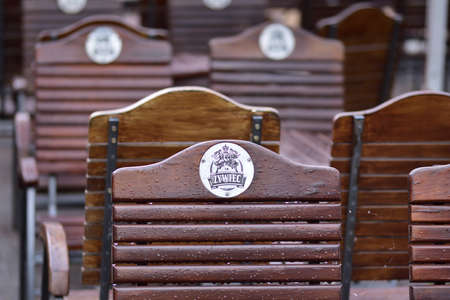 Zywiec branded chairs in a beer garden on a rainy day.