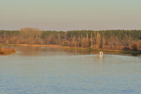 Speedboat on the river on a sunny autumn day.