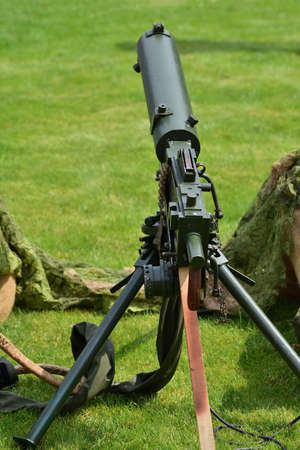 Vintage submachine guns and handguns on display in the historic summer on a sunny day. Summer. Day.