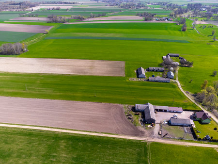 Spring fields, meadows and villages seen from a bird's eye view on a sunny, clear day.の写真素材