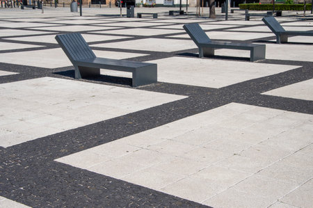 Wroclaw square lined with concrete elements and benches.の写真素材