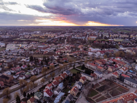 Sunset and storm clouds over the river and city on a spring day.の写真素材