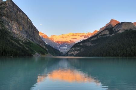 Glacier reflection on Lake Louise at Banff at dawnの写真素材