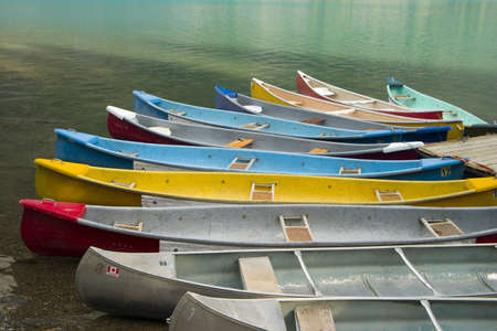 canoes parked at moraine lakeshoreの写真素材