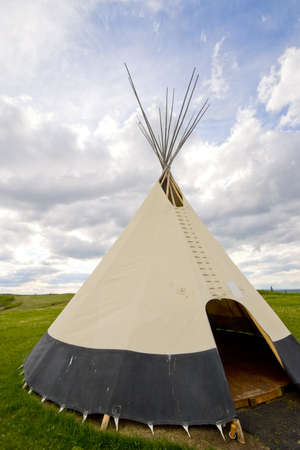 native american teepee in prairie with sky