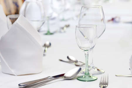 wine glasses and cutlery table settingの写真素材