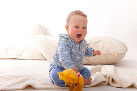 cute baby boy sitting on floor,skin