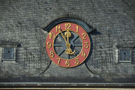 big antique clock on roof wall with moon and starの写真素材